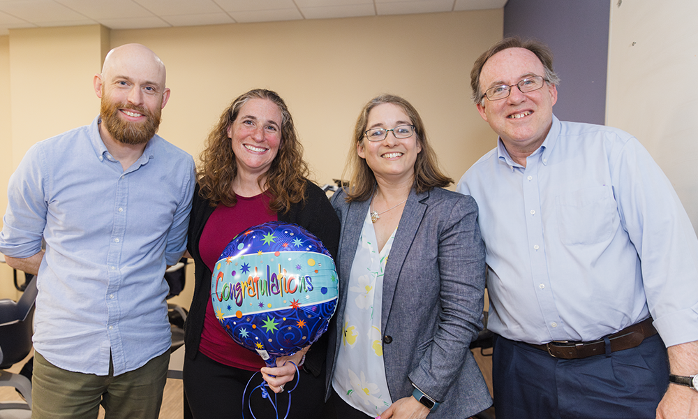 Alison Castellano, the 2024 recipient of the Ӱֱapp Teaching Excellence Award, stands proudly with previous Teaching Excellence Awardees who eagerly pass her the torch of honor! (L to R) Mike Rust (2022), Alison Castellano (2024), Hillary Bucs (2021), and Tim Vercellotti (2023 Ӱֱapp).